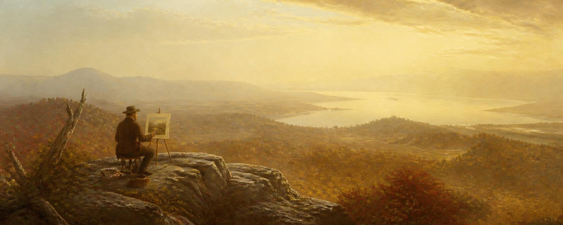 Painter on a cliff overlooking a valley
